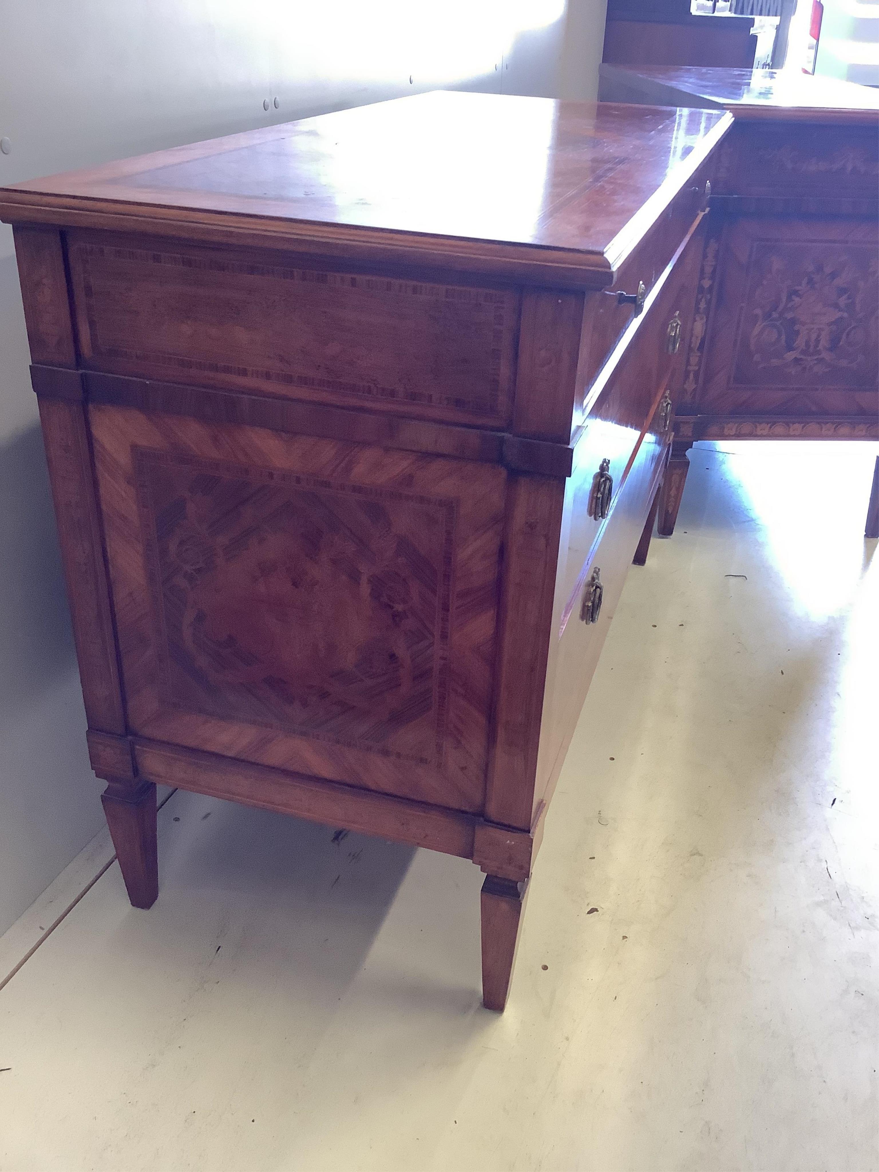 A pair of reproduction Milanese style marquetry inlaid kingwood commodes, width 128cm, depth 54cm, height 88cm. Condition - fair